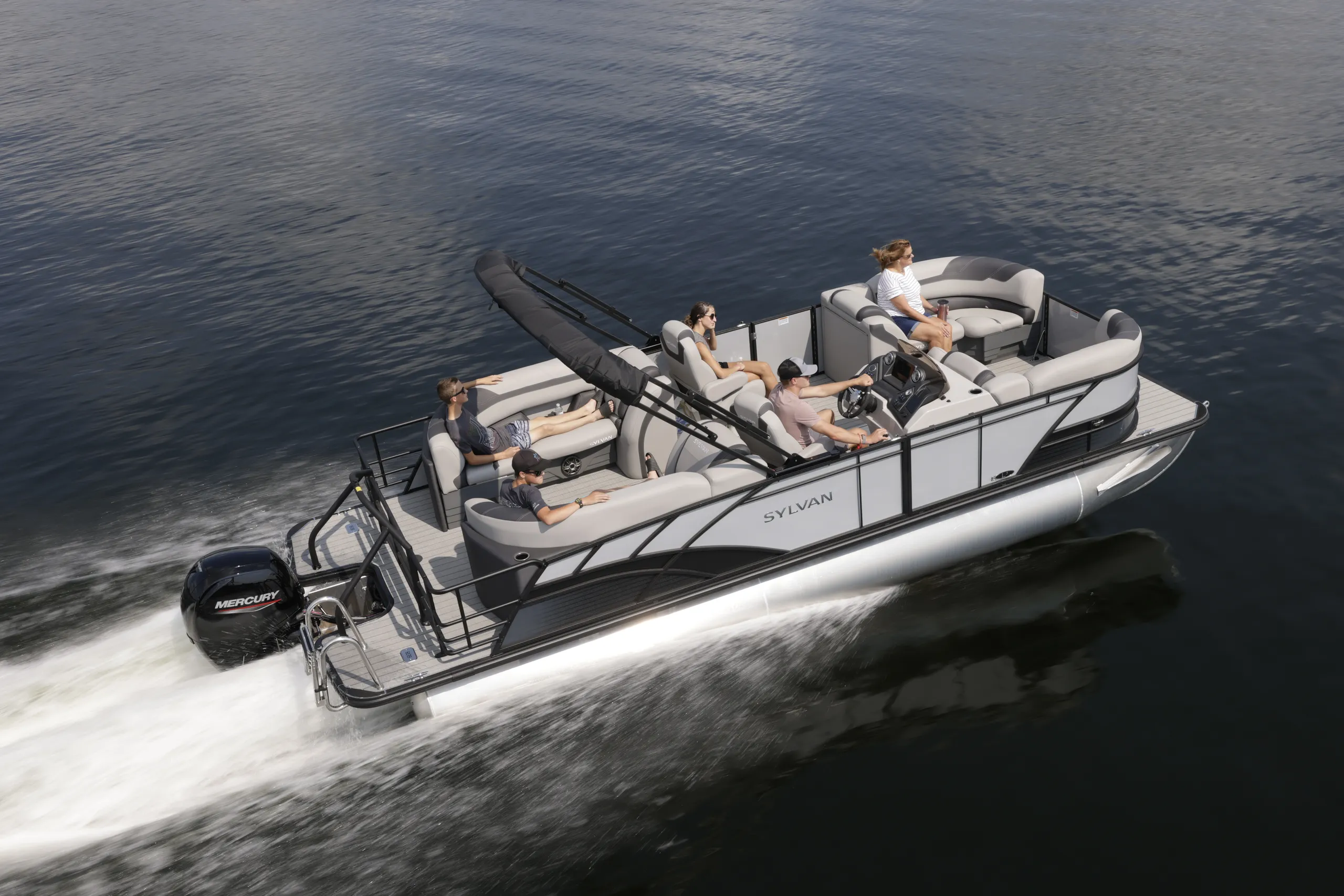 Family cruising together aboard a Sylvan pontoon boat